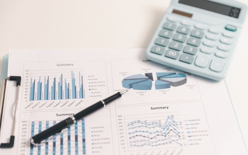 Business graph, chart on table. Financial development, banking account, statistic. Close up business people meeting to discuss situation on market. calculating investment. Business financial concept.
