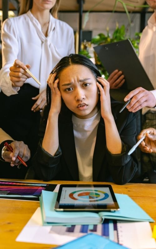 Employee feeling tired stressed with her work in the office