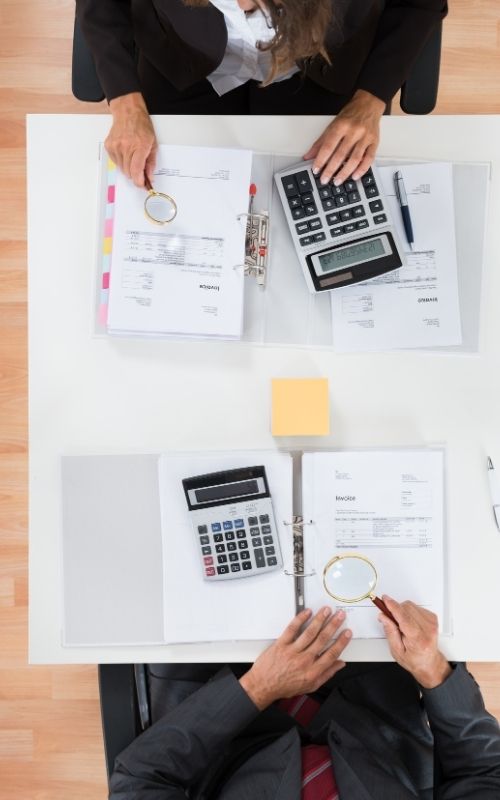 Two Businesspeople Inspecting Financial Expenses